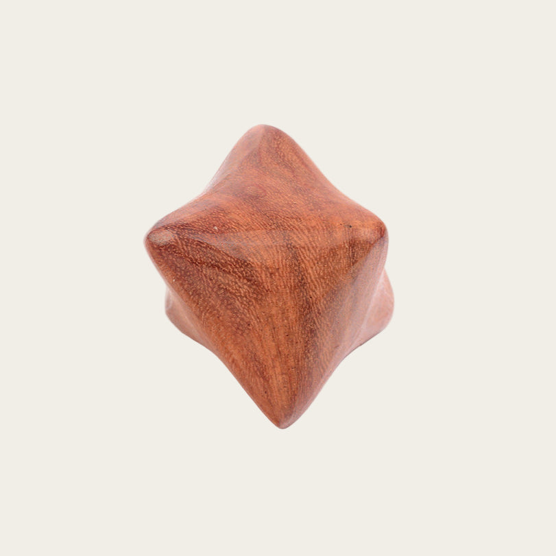 Wooden block with a star-shaped top on a white background, featuring Chinese characters.